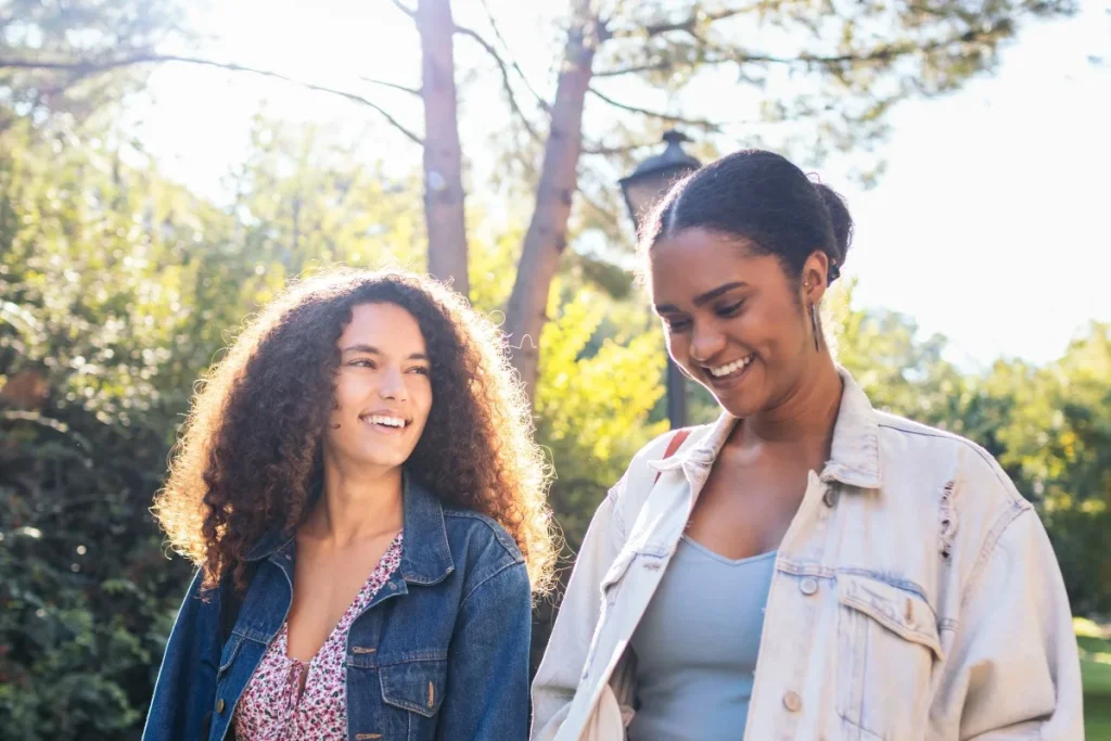 Two women talking outside